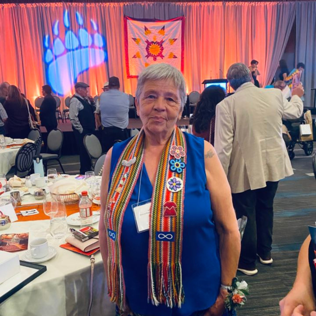 Judy Mayer, Chamber MMF Director, at an MMF event, smiling at the camera