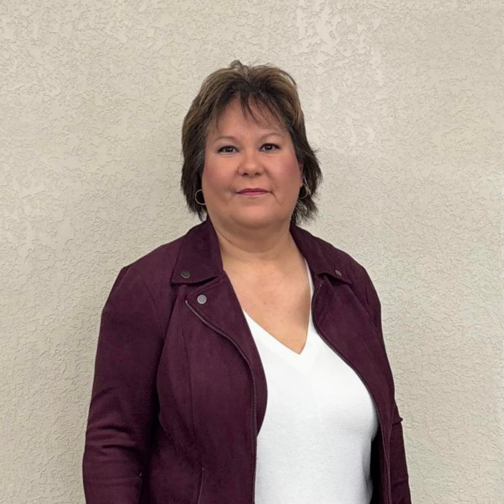 Lori Lathlin, Chamber Director OCN, smiling at the camera